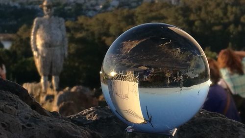 Close-up of crystal ball on rock