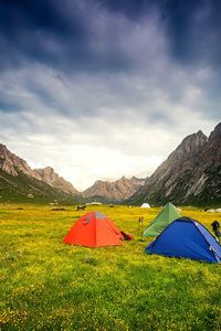 Scenic view of landscape against cloudy sky