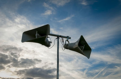 Low angle view of camera against sky