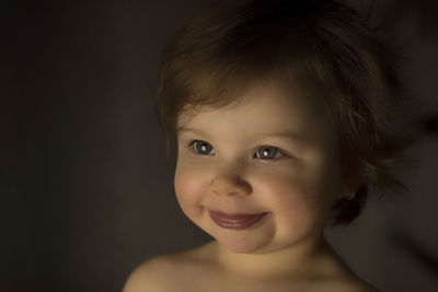 Close-up portrait of smiling girl