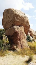 Rock formation on land against sky