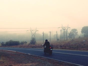 Man walking on road