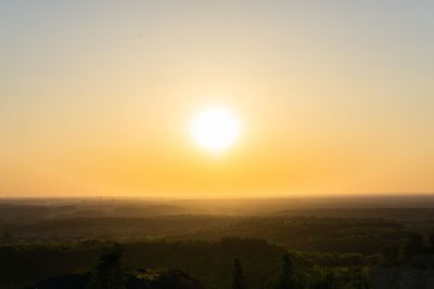 Scenic view of landscape against sky during sunset