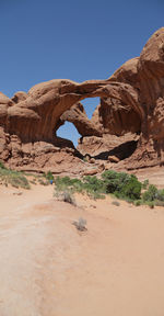 Rock formations in desert against clear sky