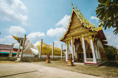 Traditional temple on building against sky