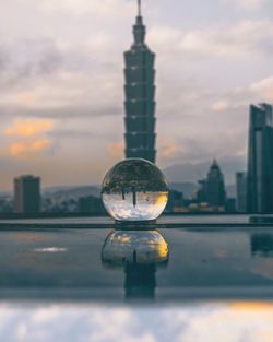 Close-up of water tower against cloudy sky