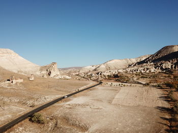 Scenic view of road against clear blue sky