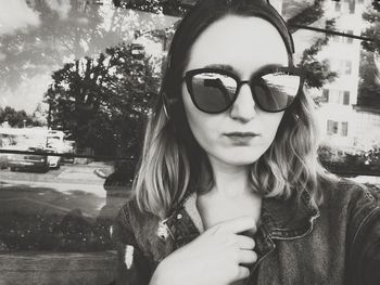 Portrait of young woman wearing sunglasses