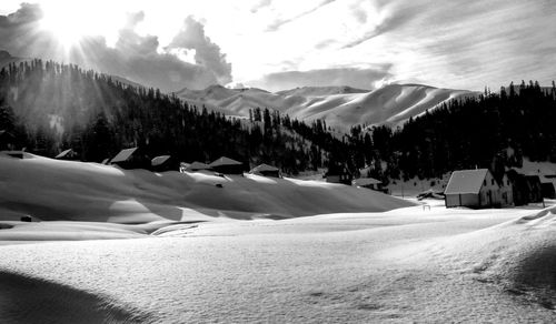 Scenic view of snowcapped mountains against sky