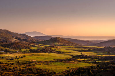 Scenic view of landscape against sky during sunset