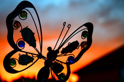 Close-up of silhouette against sky during sunset