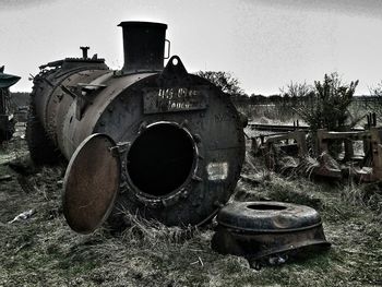 Abandoned metal structure against sky