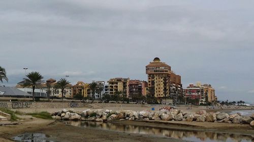 Castle by sea against sky