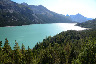 Scenic view of lake and mountains against sky