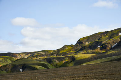 Cloudy sky over mountain ridge