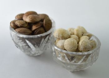 Close-up of ice cream in bowl against white background