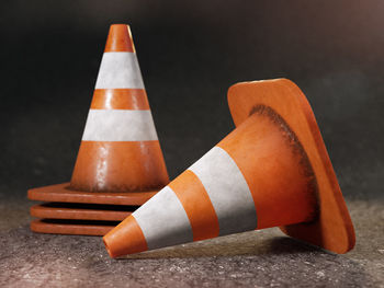 Close-up of orange flag on road