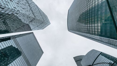 Low angle view of skyscrapers against sky