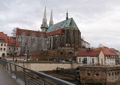 Buildings in city against sky