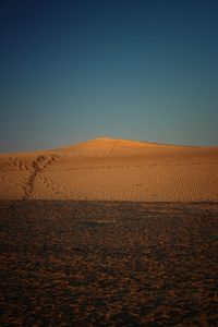 Scenic view of desert against clear sky