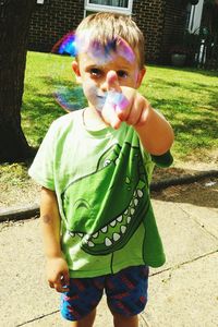 Portrait of boy playing outdoors