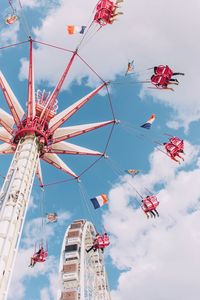 Low angle view of ferris wheel against sky