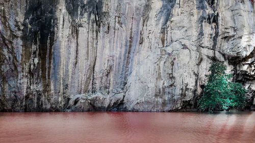 Close-up of rock formation against sea