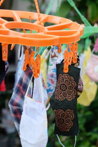 Close-up of clothes hanging at market stall