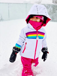 Girl wearing hat on field during winter