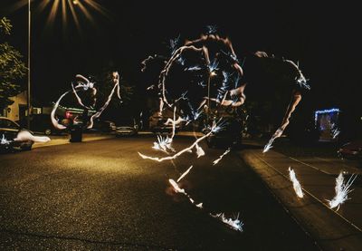 View of illuminated road at night