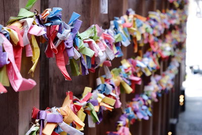 Close-up of multi colored tied hanging on clothesline