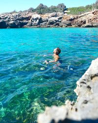 Man swimming in sea