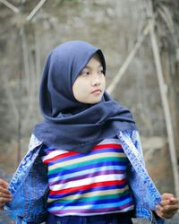 Portrait of boy standing outdoors