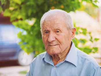 Portrait of senior man at public park