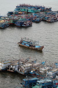 High angle view of fishing boats moored in sea