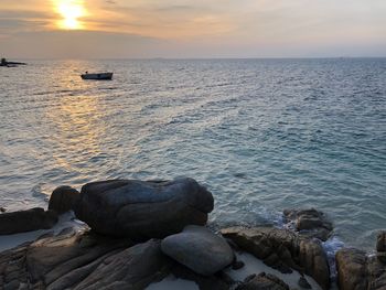 Scenic view of sea against sky during sunset