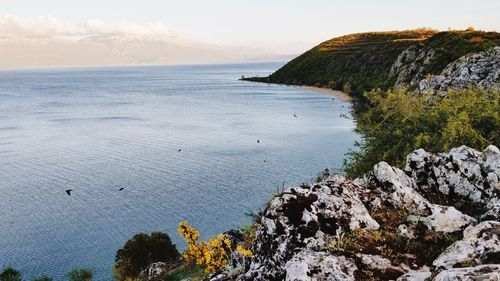 Scenic view of lake and rocks.