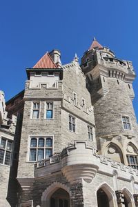 Low angle view of castle against blue sky