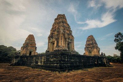 Low angle view of old ruins against sky