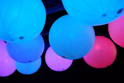 Low angle view of multi colored balloons