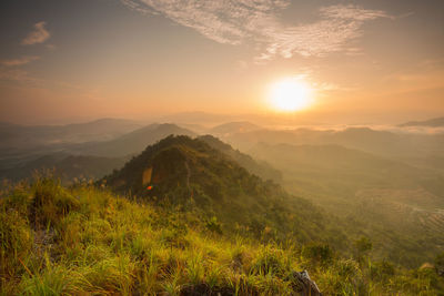 Scenic view of landscape against sky during sunset