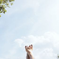 Low section of person legs against the sky
