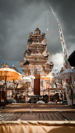 Temple against cloudy sky