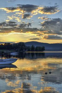 Scenic view of lake against cloudy sky