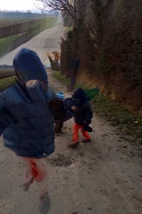 Boy with horse in background