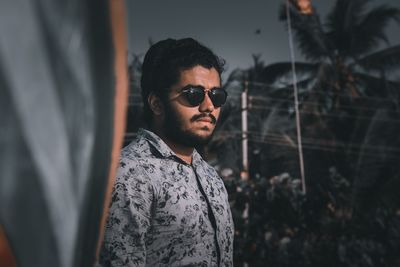 Portrait of young man looking at camera