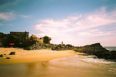 Scenic view of sea against cloudy sky