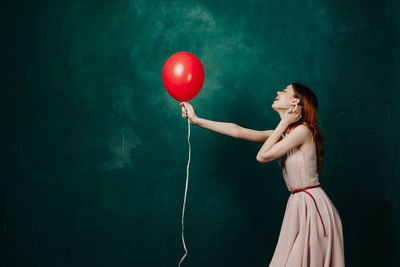 Woman holding balloons