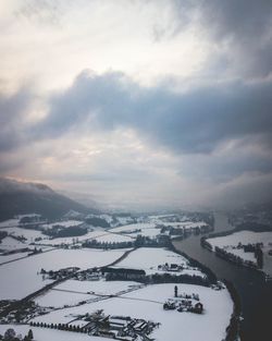 High angle view of snowcapped mountain against sky
