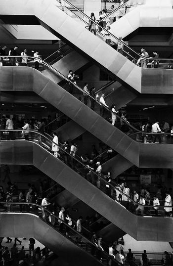 HIGH ANGLE VIEW OF PEOPLE AT STEPS